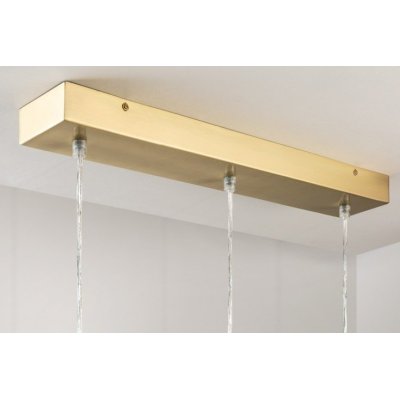ponadczasowa lampa wisząca w złotym kolorze nad stół 