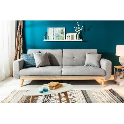 Szara sofa rozkładana styl skandynawski